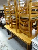 A modern farmhouse pine dining table & six ladder back rush seated chairs