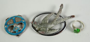 An enamel & silver antique Celtic brooch, green stone set ring & a white metal oval bird brooch