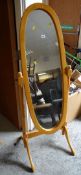 A modern pine oval cheval mirror