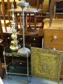 A smoky glass & brass effect tea trolley, a brass effect standard lamp, smoker's companion & brass