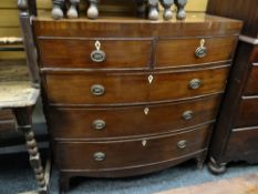 An antique bow front mahogany chest of three long & two short drawers (requires some attention)