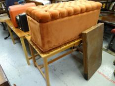 A cushioned Ottoman, two drawer desks & a pasting table