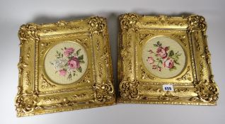 A pair of good antique framed embroidered floral panels