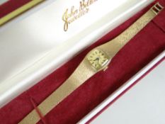 A 9ct ladies wristwatch with textured bracelet by Elco, 26grms total