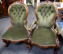 A pair of antique buttoned spoon back ladies & gentleman armchairs with carved floral rail
