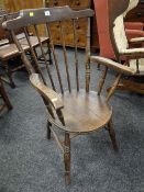 A circular seated spindle back country elbow chair