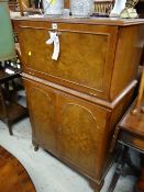 A polished two-stage cocktail cabinet