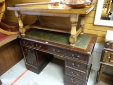 A reproduction mahogany pedestal desk together with a Long John coffee table