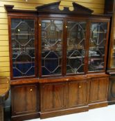 A reproduction mahogany breakfront bookcase cupboard
