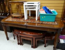 An extending mahogany oval dining table, a nest of three Grecian key design white tables & a
