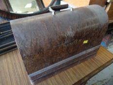 A cased Singer sewing machine