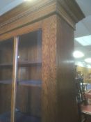 Vintage oak cupboard two-door glazed bookcase on bun feet