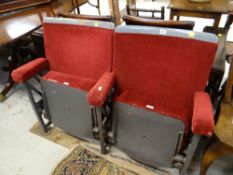 Two adjoined vintage cushioned cinema seats numbers 14 & 4 with roll-down mechanisms