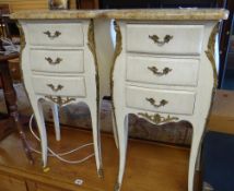 A good pair of French white painted metallic mounted marble topped bombe-shaped bedside tables