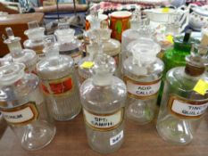 Fifteen antique pharmaceutical bottles mostly with labels