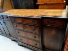 A good reproduction mahogany breakfront sideboard
