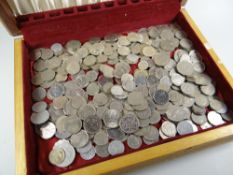 A cutlery canteen box containing a quantity of silver-coloured coinage