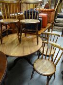A set of four good circular seated spindle back chairs & a circular top table