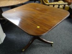 An antique mahogany tilt-top rounded rectangular tea table with reeded side & brass castors, 94cms