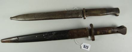 Two WW1 bayonets, one marked GEBR. HARTKOPP SOLNGEN to the blade, both with their covers