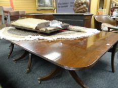 A good mahogany extending triple pedestal dining table with three centre leaves fully extending to