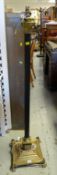 A Corinthian-type architectural antique standard lamp with stepped brass platform base