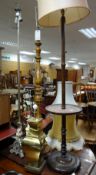 A parcel of lighting including two standard lamps & a brass effect table lamp etc