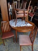 G-Plan teak extending dining table together with six chairs (4+2)
