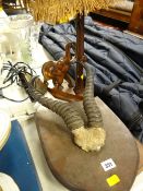 A pair of mounted antelope horns, a carved elephant table lamp etc
