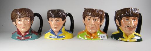 The full set of four Royal Doulton 'The Beatles' character jugs (all boxed) & signed by Michael