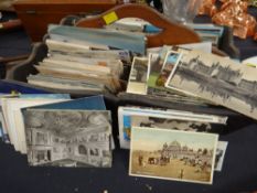 An antique wooden cutlery box & a quantity of old postcards