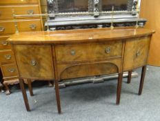 An antique inlaid mahogany bow front sideboard with brass railback, two centre drawers & a pair of