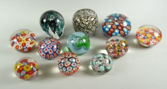 Eleven late twentieth century colourful glass paperweights