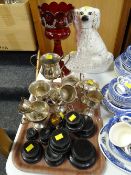 An antique painted glass vase, a single Staffordshire dog, sundry EPNS trophies etc