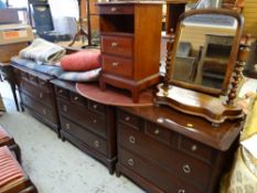 A suite of Stag Minstrel bedroom furniture comprising three chests & a narrow bedside chest