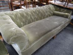A large velvet covered button chesterfield-type sofa, 224cms wide