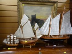 Four model ships on stands (located on furniture)