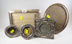 Five silver picture frames including an Art Nouveau decorated example, an oval example & a