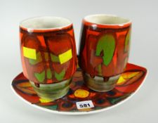 A set of three late twentieth century Poole flambé pottery items with monogrammed bases