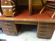 A good vintage office desk with a bank of eight drawers having stylish handles & a centre lockable