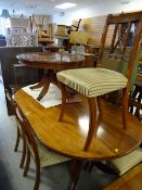 Large reproduction mahogany oval dining table with six matching chairs in Regency stripe together