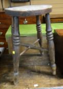 A naive circular topped farmhouse or milking stool