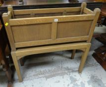 A wooden raised flower planter & a reproduction leather topped cabinet bookcase