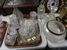 A quantity of cut glass including three decanters, a ceiling shade etc