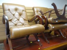 A pair of reproduction antique buttoned leather & studded elbow chairs & stool