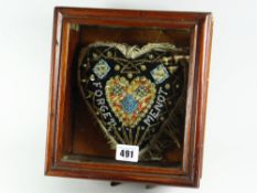 A cased heart shaped sweetheart's bead & needle work forget-me-not pin-cushion