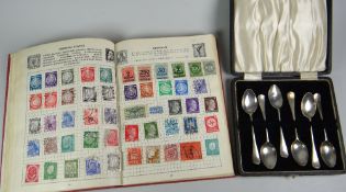 A red 'Improved Postage' stamp album with approximately 20% content together with a set of silver