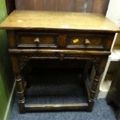 An antique-reproduction side-table with single drawer