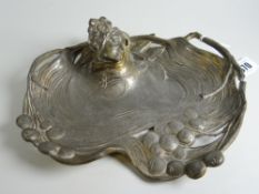 An Art Nouveau ink well in the form of a female head with leaves & berries