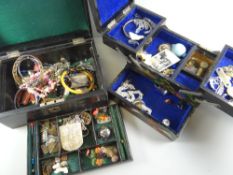 A vintage leather covered two-section jewellery box with contents & a concertina musical jewellery